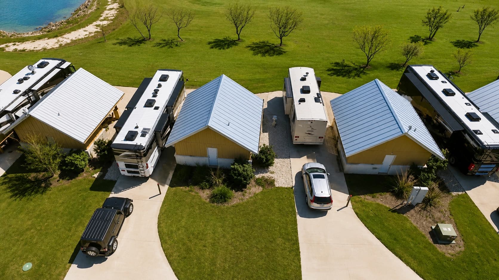 Real photo of the Alsatian Casita RV Sites at dusk — stone-based structures with covered outdoor kitchens